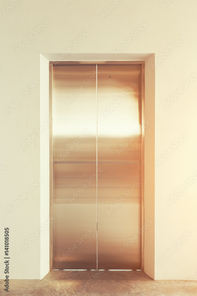 Elevator door or steel door inside office building.