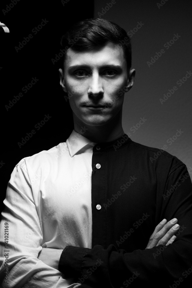 Low key portrait of a man in different shirts in black and white. Low key portrait of a man in different shirts in black and white.