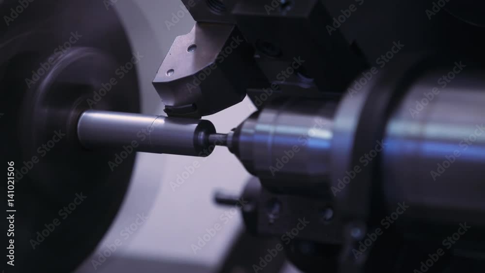 Metal turning. CNC machine tool cuts out metal parts. Automatic production process. Сlose-up. 4k footage.
Metal turning. CNC machine tool cuts out metal parts. Automatic production process. Сlose-up. 4k footage.