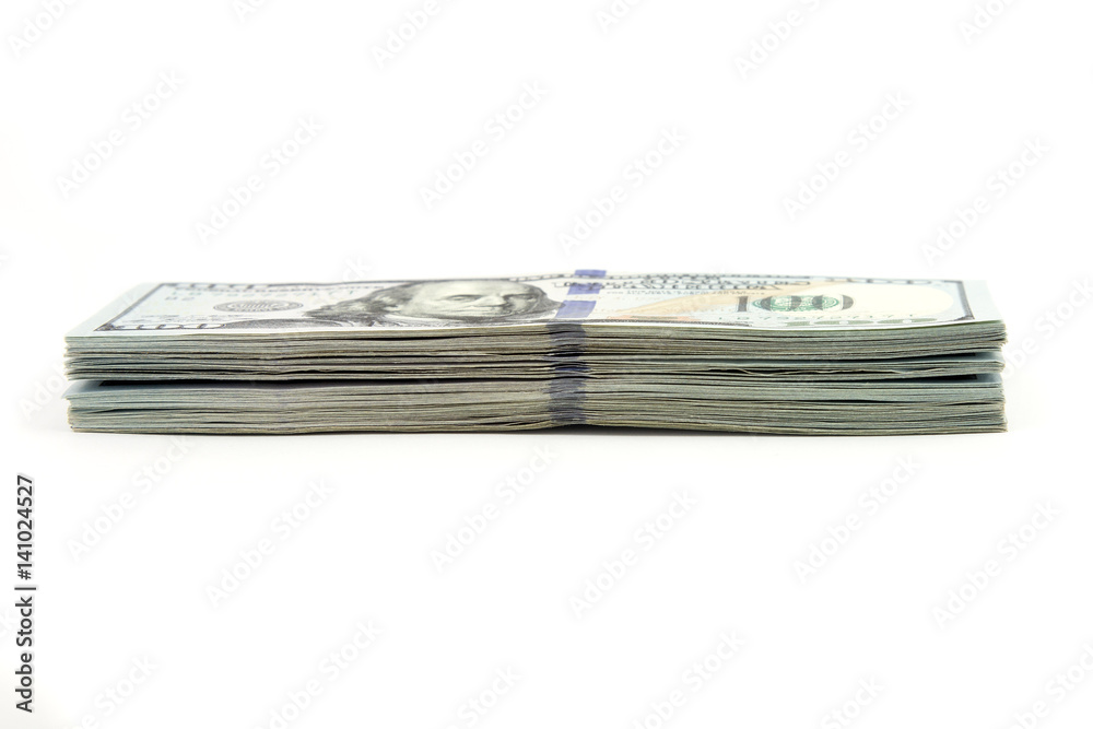Many bundle of US 100 dollars banknotes on a white background