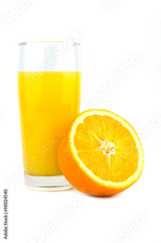 Fresh ripe orange and orange juice on a wooden background. Close up