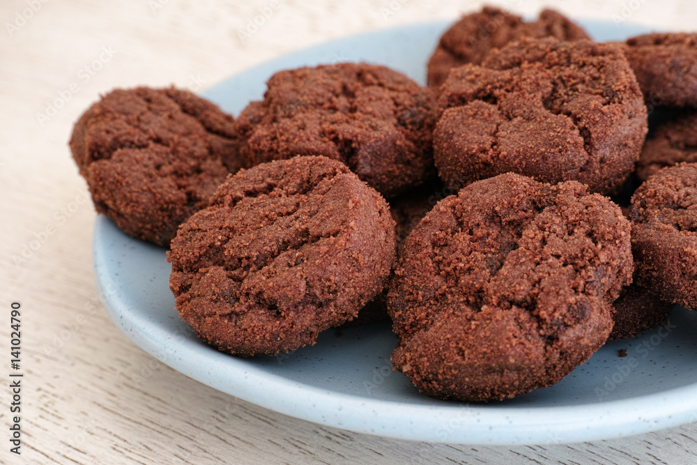 Gluten free cookies with chocolate chips on a blue plate Gluten free cookies with chocolate chips on a blue plate