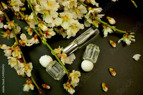 Perfume samples with spring almond flowers