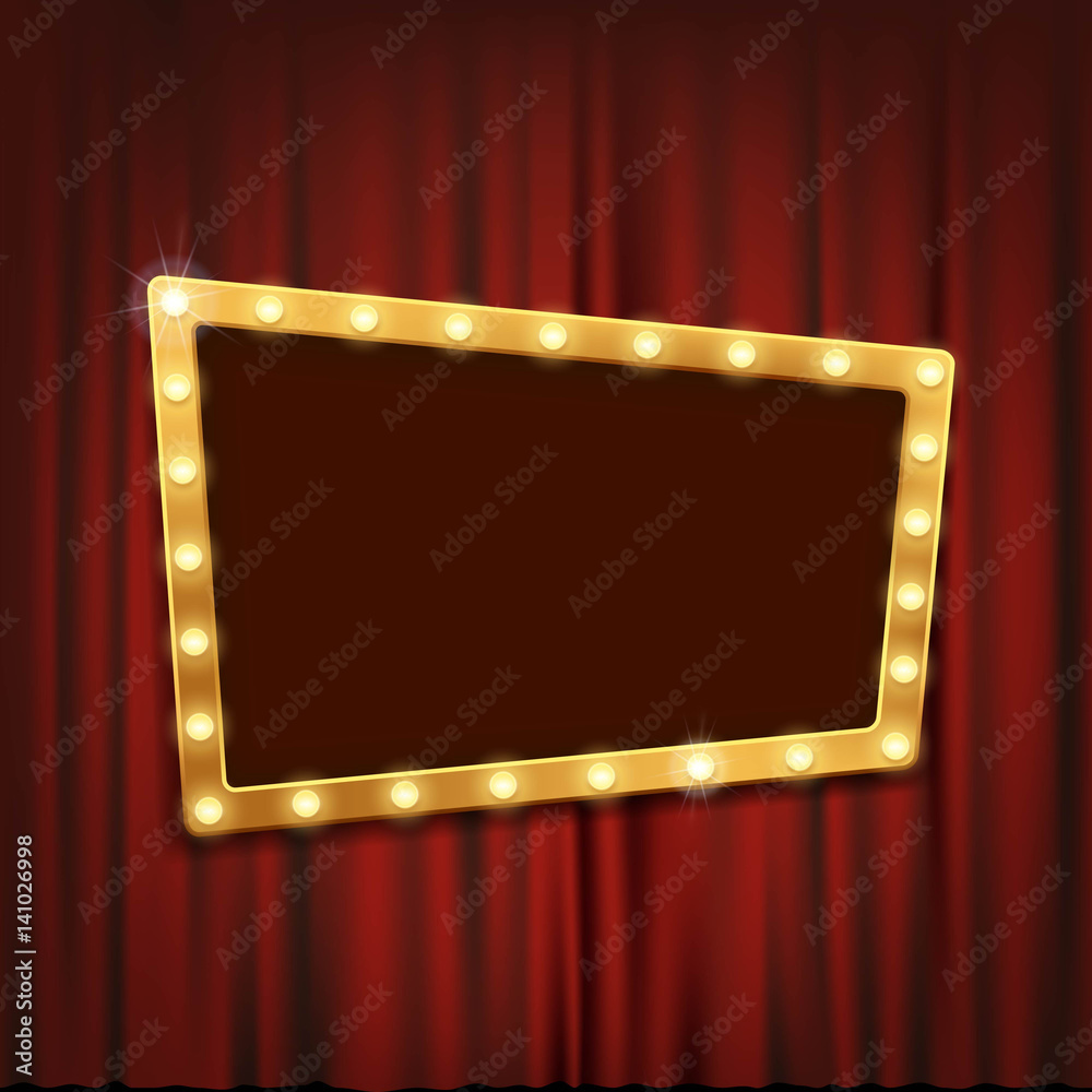 Fototapeta premium Gold frame with light bulbs on the red theatrical curtain.