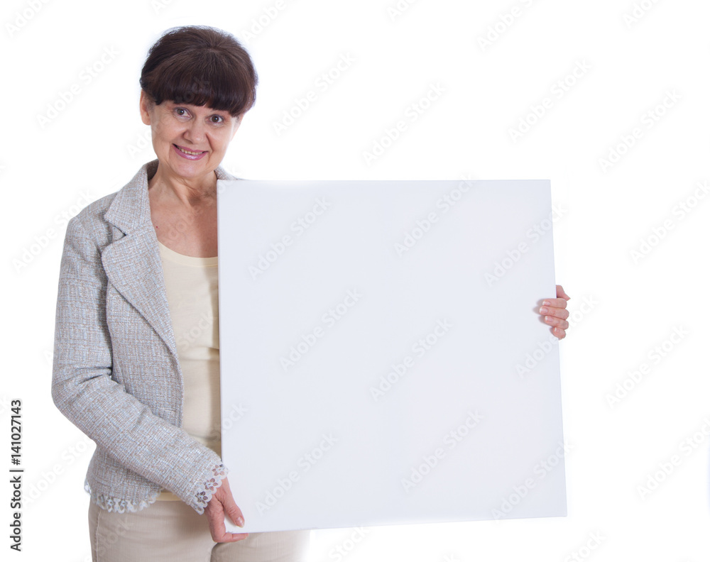 Mature woman leaning on white banner. Portrait against of white background Mature woman leaning on white banner. Portrait against of white background