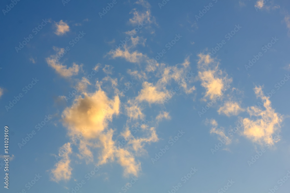White clouds against blue sky. Day.
