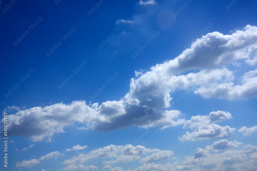 White clouds against blue sky. Day.