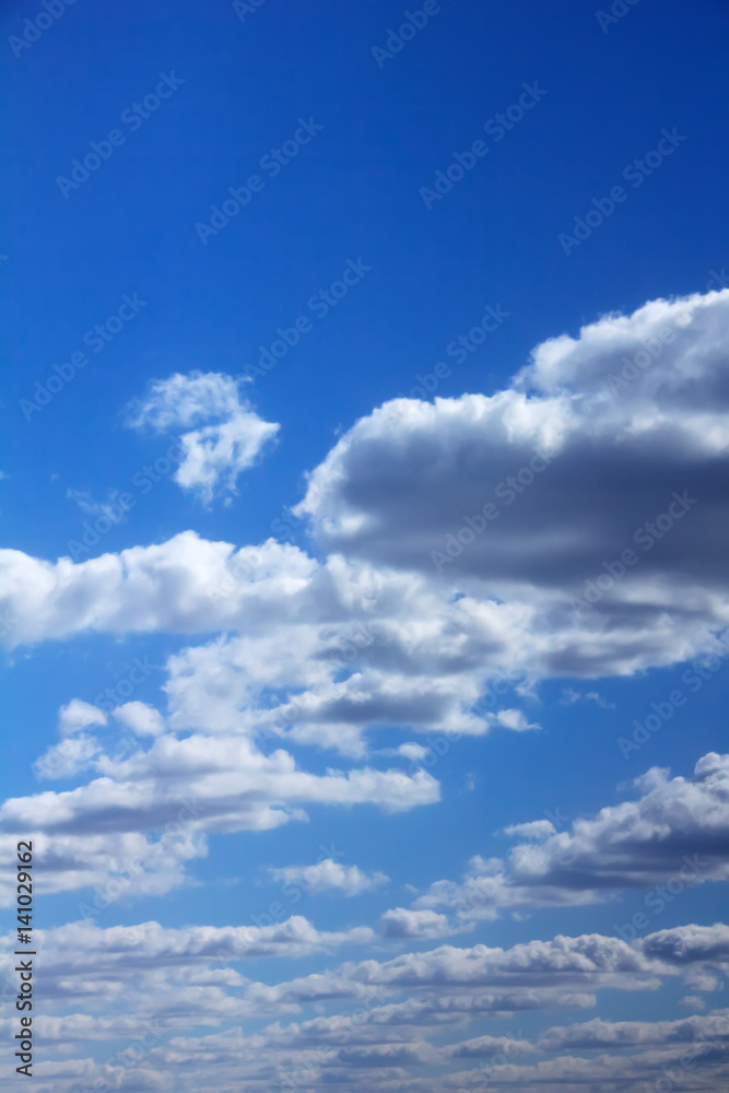 White clouds against blue sky. Day.
