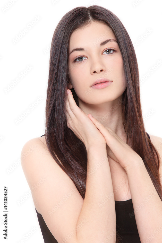 Young beautiful healthy teen girl with long hair and clean make-up over white background