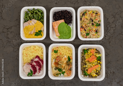 A variety of fast food in plastic boxes