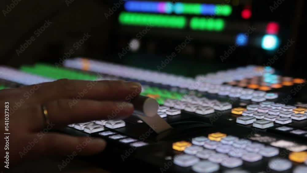 Director works with the video mixer during live broadcast on TV. Close up Director works with the video mixer during live broadcast on TV. Close up