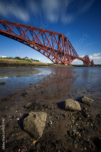 The Forth Rail Bridge is a cantilever railway bridge opened in 1890 that crosses the Firth of Forth between Edinburgh and Fife in Scotland. It is the second largest bridge of its kind in the world.