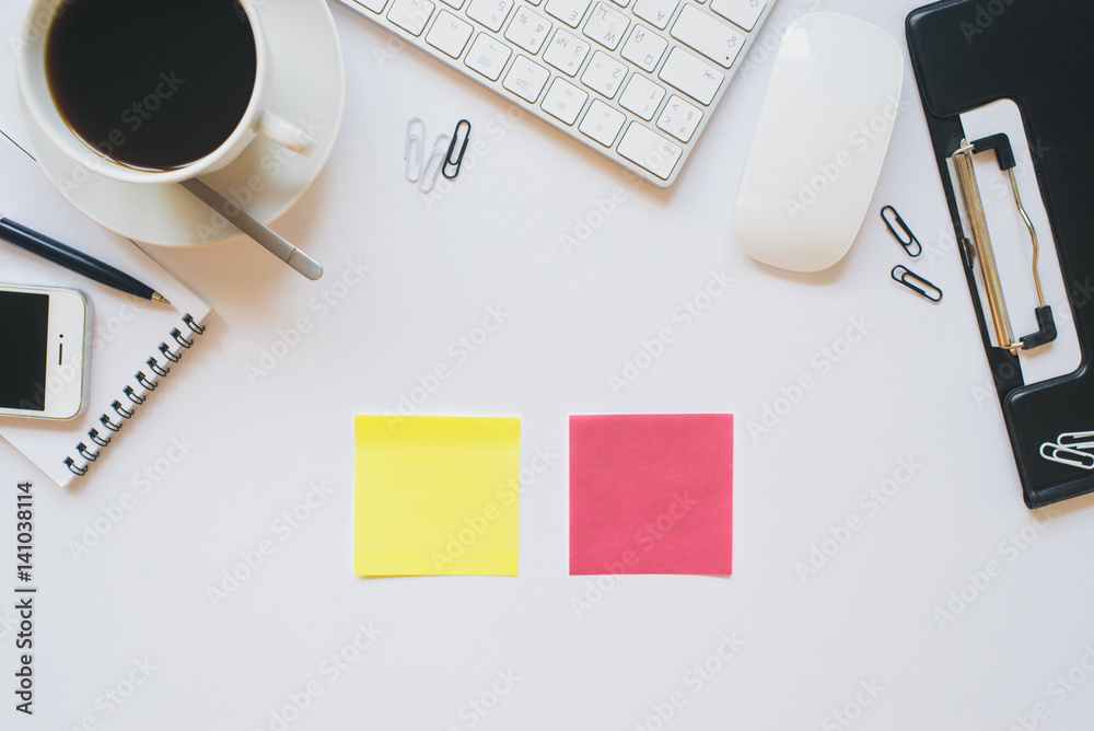 Office items on a white table. Empty stickers without labels Office items on a white table. Empty stickers without labels