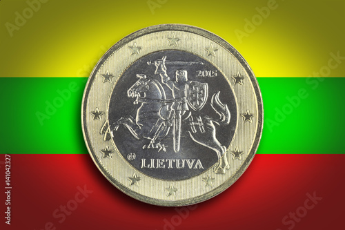 Lithuanian cash money. Lithuania flag as a background. Reverse side of One euro coin on the Lithuania flag. Macro image. photo