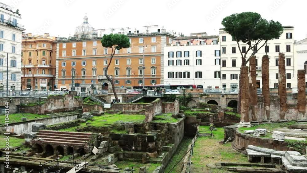 Square of Argentina (Largo di Torre Argentina) in Rome, Italy hosts four Republican Roman temples, and the remains of Pompey's Theatre. Location of archeological dig. Slow pan. Square of Argentina (Largo di Torre Argentina) in Rome, Italy hosts four Republican Roman temples, and the remains of Pompey's Theatre. Location of archeological dig. Slow pan.