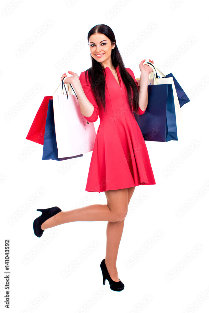 Young brunette woman with some shopping bags Young brunette woman with some shopping bags