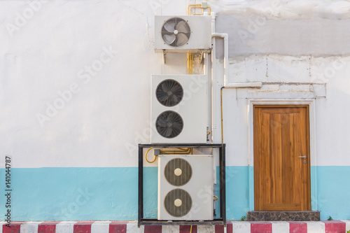 Air compressors heat pump on the wall © phonrat