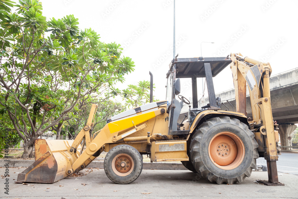 Back Hoe still on road