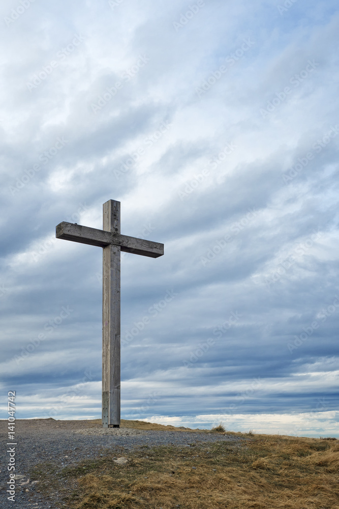 Wooden cross on mountain peak