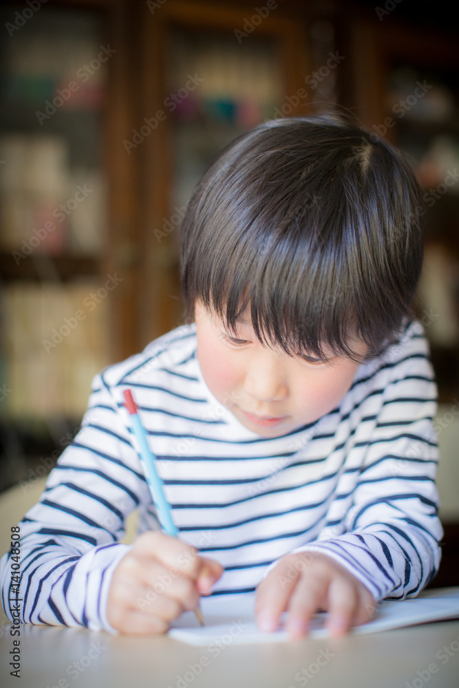 boy studying or doing home work boy studying or doing home work
