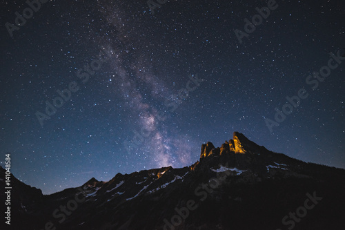 View of mountain peak against starry sky at night sky photo