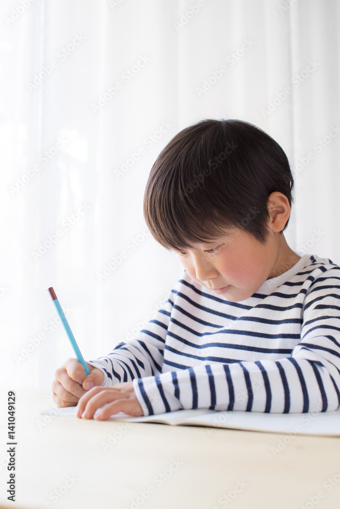 boy studying or doing home work boy studying or doing home work