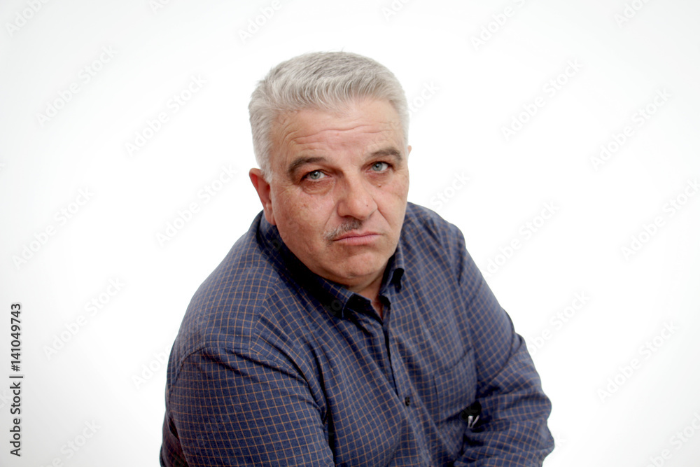 Portrait of a senior man with half mustache Portrait of a senior man with half mustache