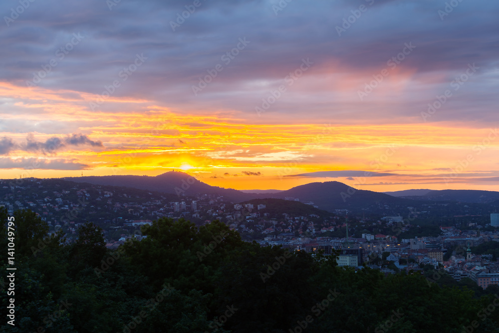 Evening panorama of Budapes from Gellert Hill with a beautiful sunset sky