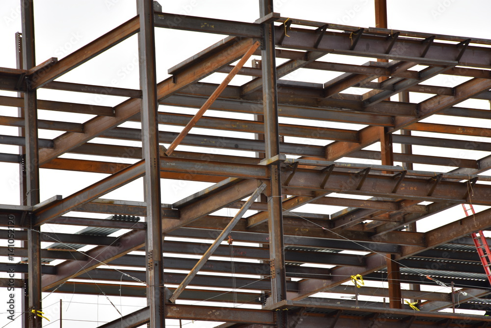 Multi-story steel frame commercial building under construction.