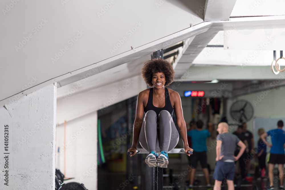black woman doing parallel bars Exercise black woman doing parallel bars Exercise