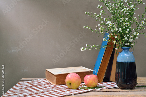still life: Daisies on old wood.