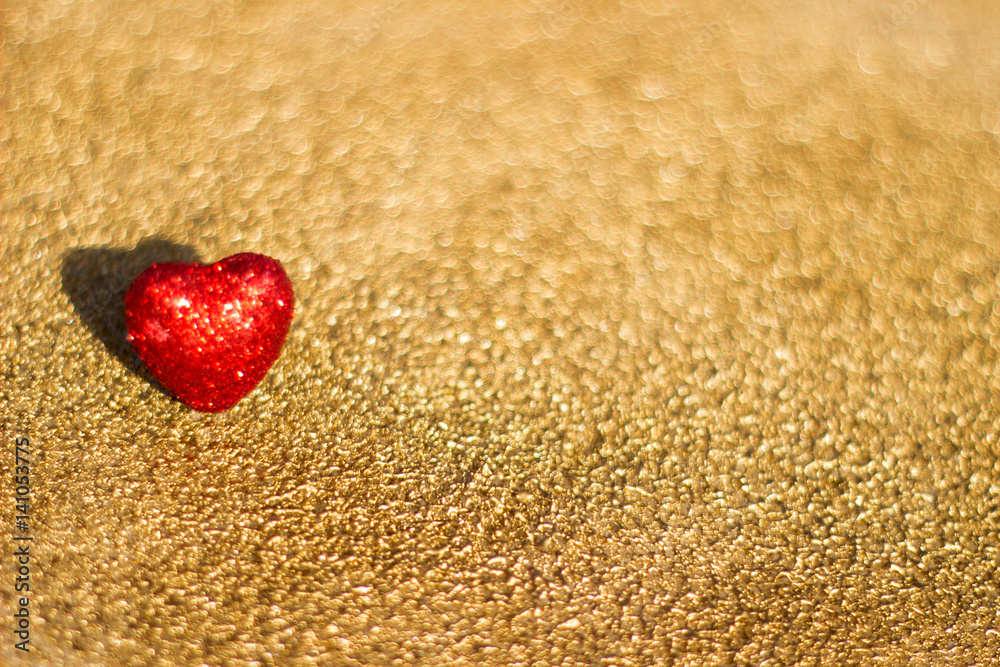 Fototapeta premium Red heart on a gold background, abstract