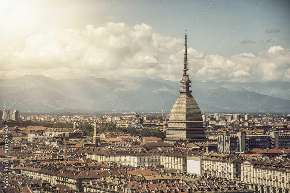 Panoramic view of Turin city center, in Italy, in a sunny day, with Mole Antonelliana and Alps in the background