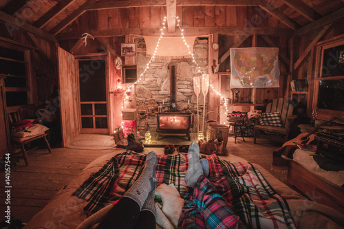 Couple lying on bed in cosy ranch style room 
