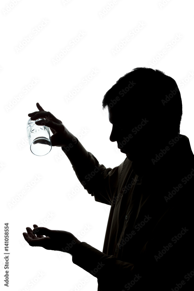 Young man drinks soda water, no water - silhouette