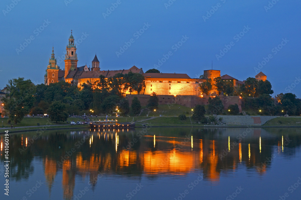 Panoramic view on Wawel Castle and the Vistula in Krakow by night, Poland, Europe