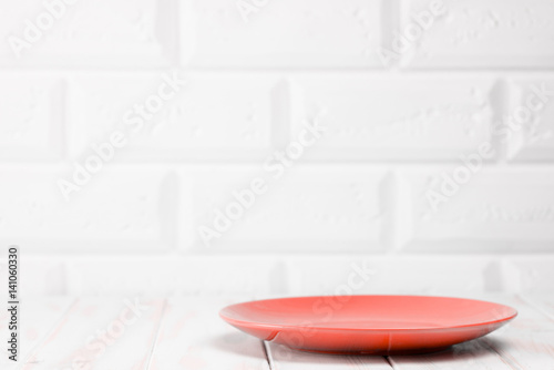 Red plate on the kitchen table