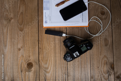 Wallpaper Mural Close up image of a day planner with smart devices next to it used for social media and planning Torontodigital.ca