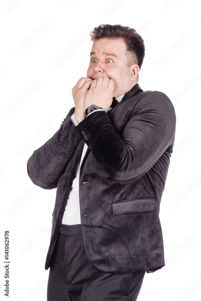 business man biting his nails fingers freaking out. human emotion expression and lifestyle concept. image on a white studio background.. business man biting his nails fingers freaking out. human emotion expression and lifestyle concept. image on a white studio background..