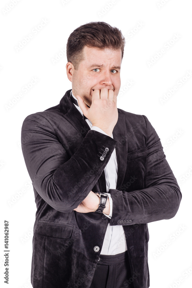 business man biting his nails fingers freaking out. human emotion expression and lifestyle concept. image on a white studio background.. business man biting his nails fingers freaking out. human emotion expression and lifestyle concept. image on a white studio background..