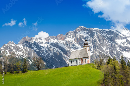 Church of Dienten am Hochkönig in front of a snowy mountain range, Pinzgau, Salzburg, Austria