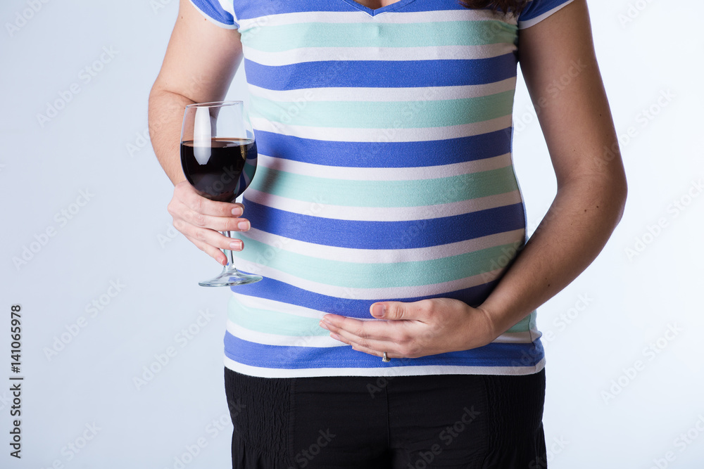 Pregnant woman drinking, causing harm to her unborn fetus, by giving it