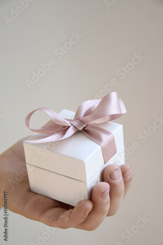 Fototapeta Naklejka Na Ścianę i Meble -  a gift in a white box with a pink bow