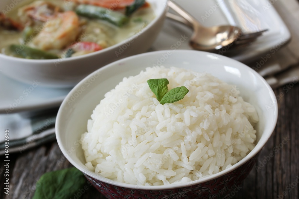 Thai jasmine rice served with Shrimp green curry sauce, selective focus Thai jasmine rice served with Shrimp green curry sauce, selective focus