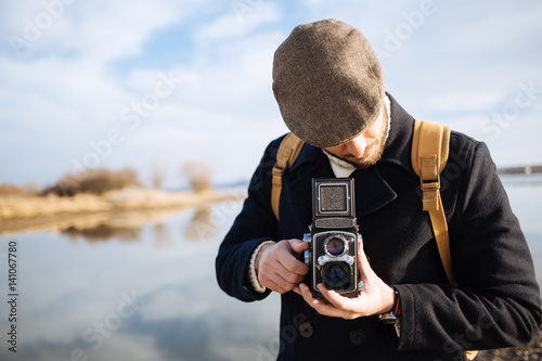 Photographer with vintage photo camera photo