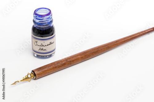 Caligraphy pen and blue ink in glass bottle