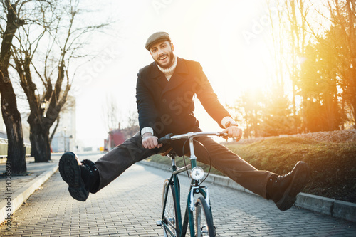 Man with bicycle having fun photo