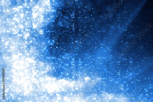 Abstract blue round bokeh or glitter lights isolated on black background. Circles and defocused particles
