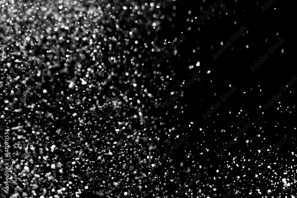 Falling realistic snow isolated on black background - design element