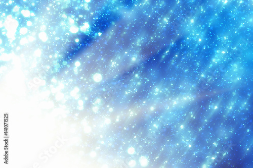 Abstract bokeh glitter lights and rays on blue background. Round defocused circle particles. Christmas template